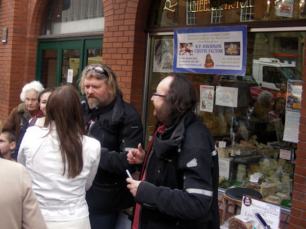 Si and Dave talk to Chesterfield Market visitors outside The Cheese Factor shop
